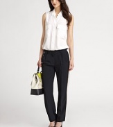 These impeccably tailored, simply elegant pants are crafted in a slimming silhouette with the requisite side stripe.Flat waist with belt loopsFront hook closureZip flyFront angled pocketsRise, about 9Inseam, about 29TriacetateDry cleanImportedModel shown is 5'10 (177cm) wearing US size 4. 