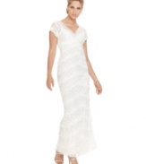 This romantic Onyx lace white dress captures a unique vintage look with its cascading, crisscrossing tiers of lace and scalloped hem.