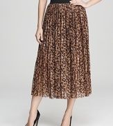 Pull on this VINCE CAMUTO leopard maxi skirt when your look could use an instant shot of cool. A shorter lining peeks out for a chic high/low shadow effect.
