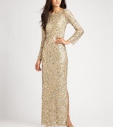 This gorgeous, floor-length sequined style features long sleeves and an alluring, low-cut back.Wide necklineLong sleevesAllover sequinsSide slitV back with concealed zipFully linedAbout 45 from natural waistNylonSpot cleanImported