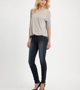 Dark-wash skinnies styled with contrasting leather trim and slight fading. THE FITSkinny fitRise, about 8½Inseam, about 30THE DETAILSButton closureZip flyFour-pocket styleFully linedBody: 92% cotton/7% polyester/1% spandex; Contrast: LeatherDry cleanMade in USAModel shown is 5'10 (177cm) wearing US size 24.