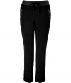 With a sporty cut and luxe lambskin waistband, Steffen Schrauts black drawstring pants are the perfectly versatile choice for dressing up and down - Leather elasticized drawstring waistband, zippered side slit pockets, cuffed ankles - Loosely tailored fit, ankle length - Wear with a feminine satin top and heels