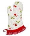 The cherry on top of being a master chef! Put your personal touch on your space with this printed oven mitt, which features a contrasting cherry and polka dot design with a burst of red and pink frilly trim. Step up to the oven with confidence & style!