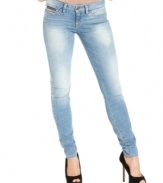 Exposed-zipper pockets add edge to these GUESS skinny jeans  -- a perfect new addition to your denim wardrobe!